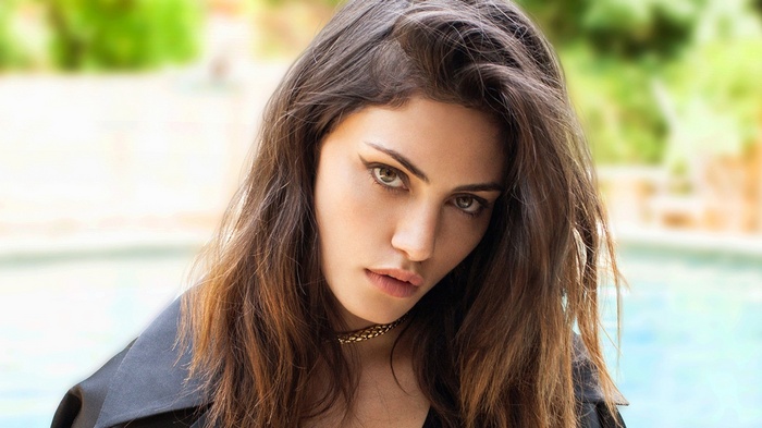 Phoebe Tonkin wearing a black coat