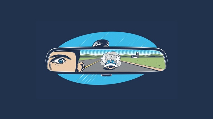 Man driving, Blue Shell in rearview mirror