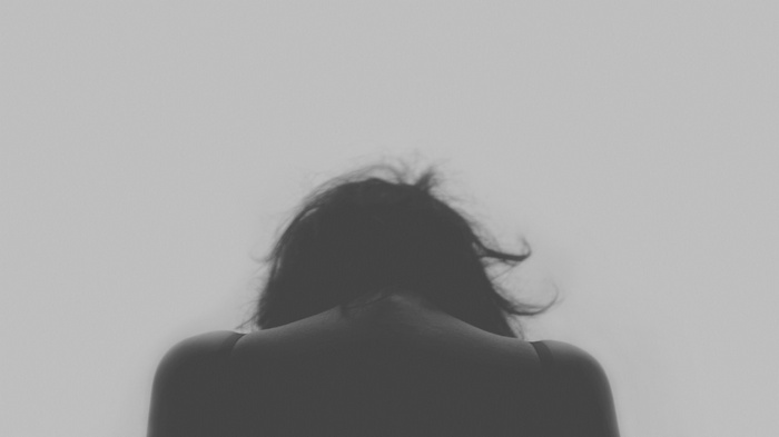 Monochrome image of a woman from behind