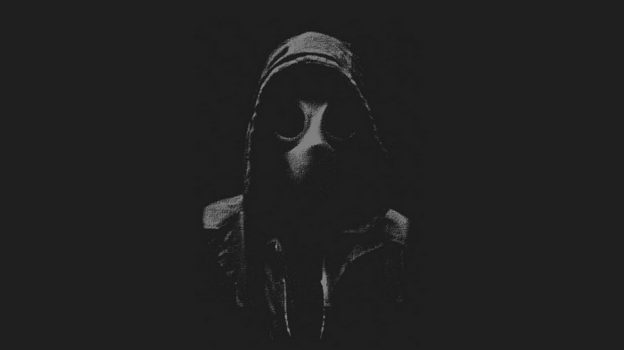 Person in a gas mask and hood