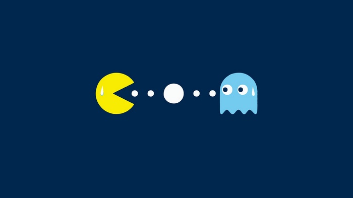 Pac-Man and ghost on dark blue background