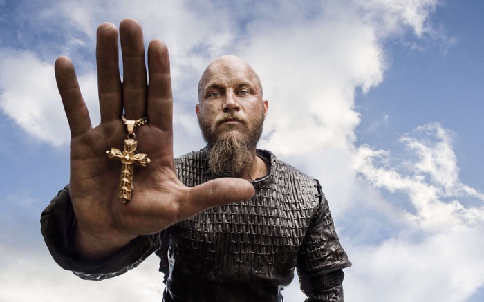 Ragnar Lothbrok from Vikings holding a cross