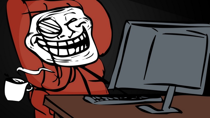 Troll Face meme character drinking coffee at computer