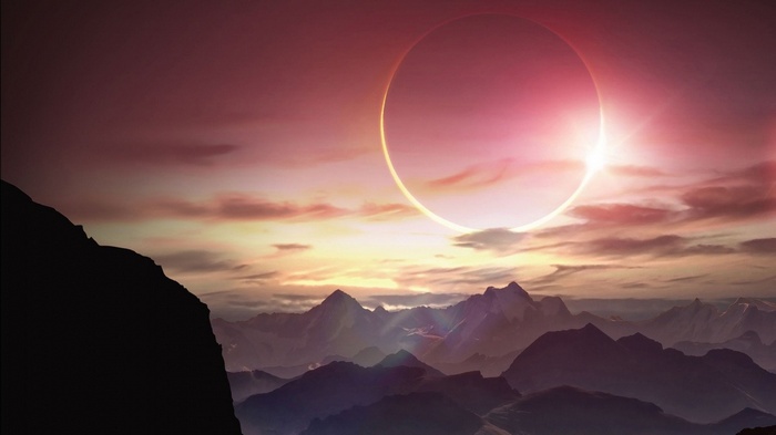 Solar eclipse over a mountain range