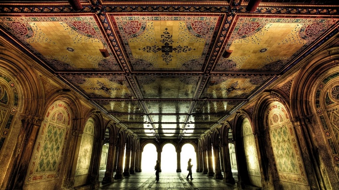 Hallway with ornate tiled ceiling and arches