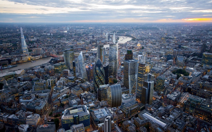 Aerial view of London cityscape with the River Thames at sunset