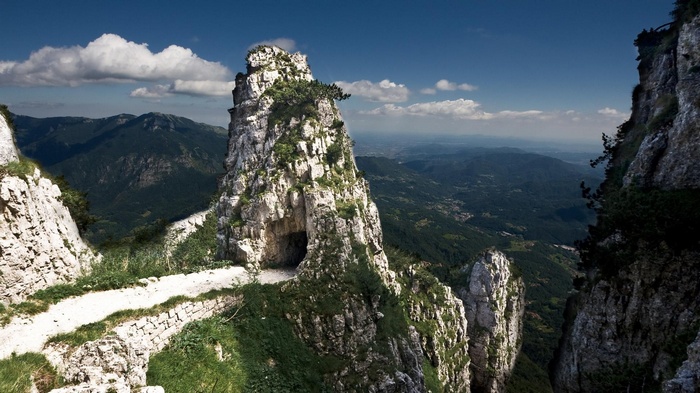 Mountain path carved into a rocky cliff face