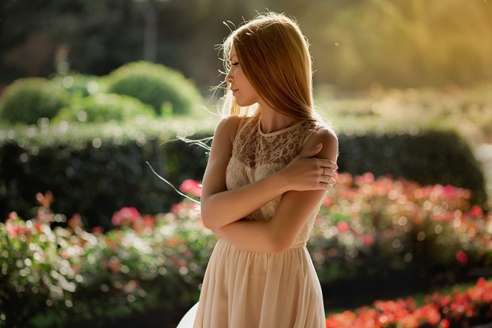 Woman in a white dress in a garden