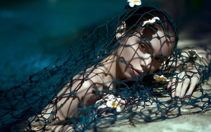 Woman with flowers in her hair and net
