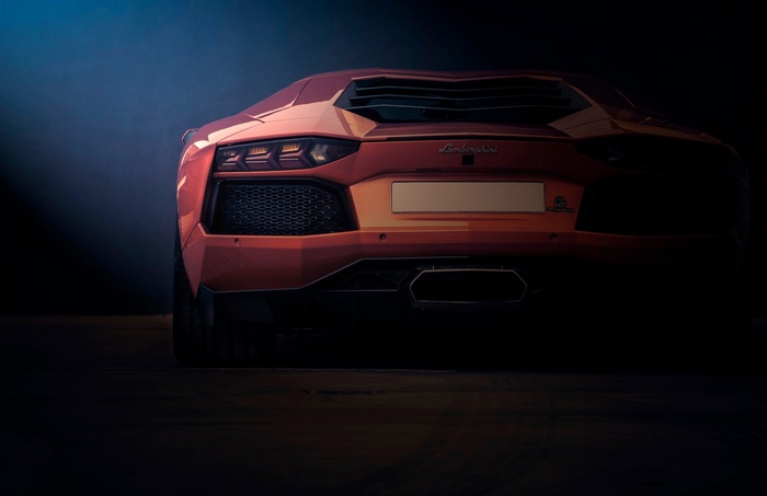 Rear view of an orange Lamborghini Aventador