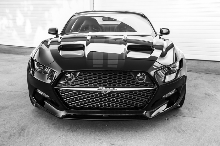 Black Ford Mustang GT with racing stripes