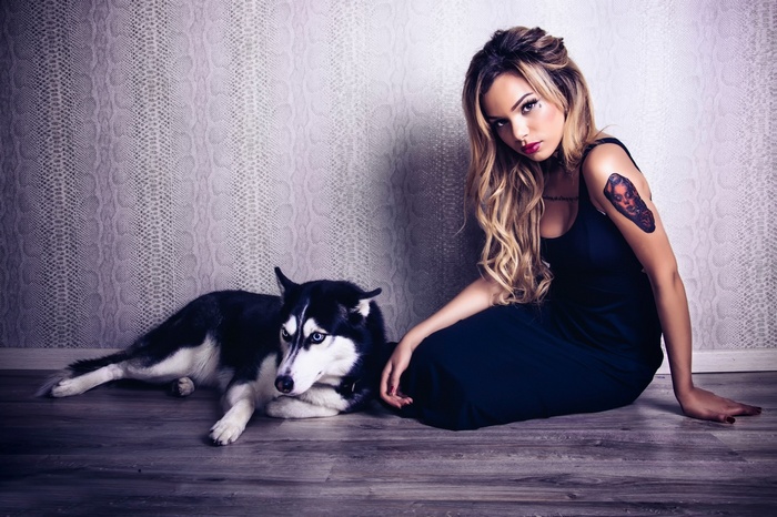 Woman and Siberian Husky on the floor