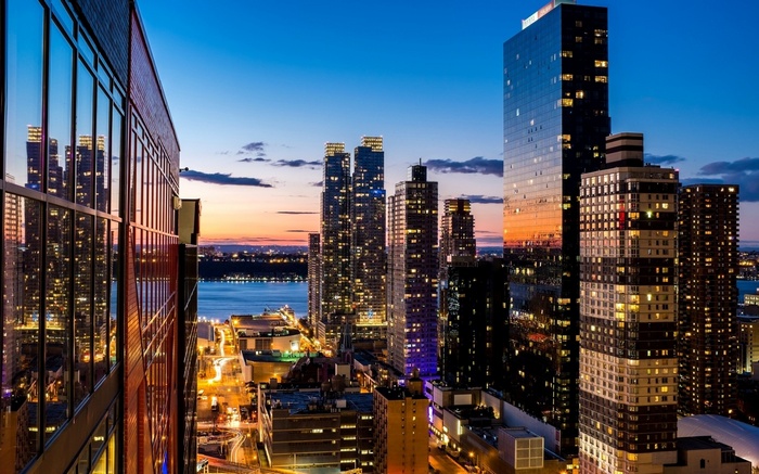 New York City skyscrapers at dusk over the river