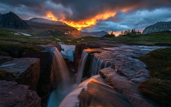 Sunset over waterfalls in Glacier National Park, Montana