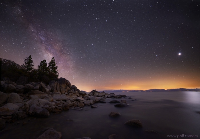 Milky Way over rocky shore at night