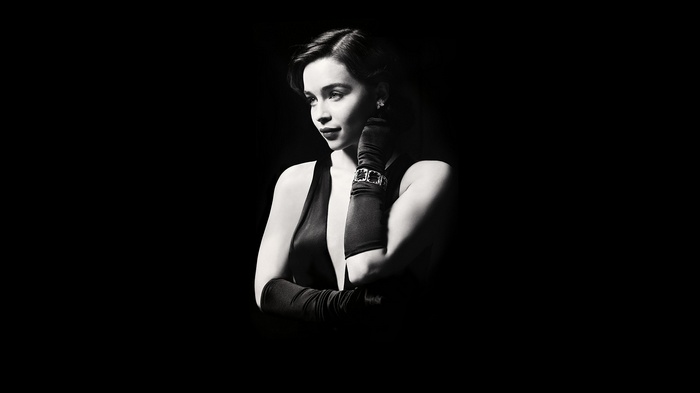 Emilia Clarke in a black dress and gloves