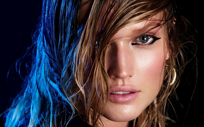 Toni Garrn with wet blonde hair and blue lighting
