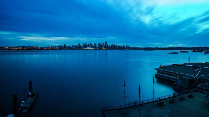 Vancouver skyline across the water at dusk