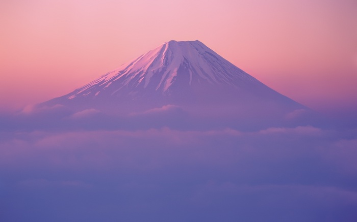 Mount Fuji shrouded in mist at sunrise