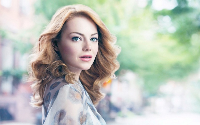 Emma Stone looking over her shoulder