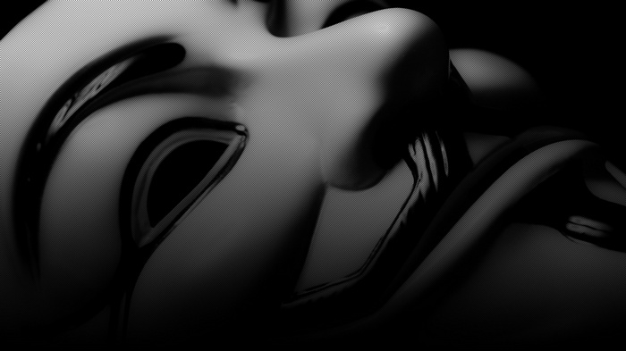 Close-up of a Guy Fawkes mask with dark, reflective elements