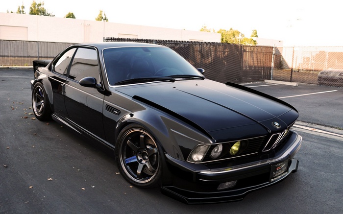Black modified BMW E24 M6 coupe with widebody kit