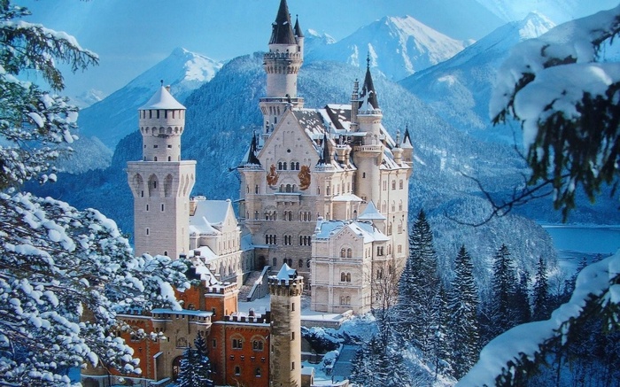 Neuschwanstein Castle in a Snowy Mountain Landscape