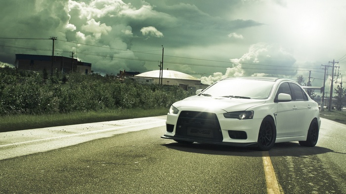 White Mitsubishi Lancer Evo X on a Road