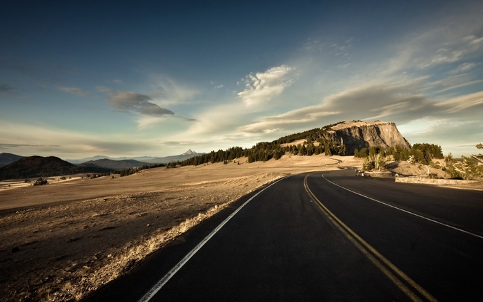 Road curving through a mountainous landscape