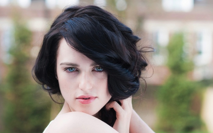 Katie McGrath with dark hair and blue eyes