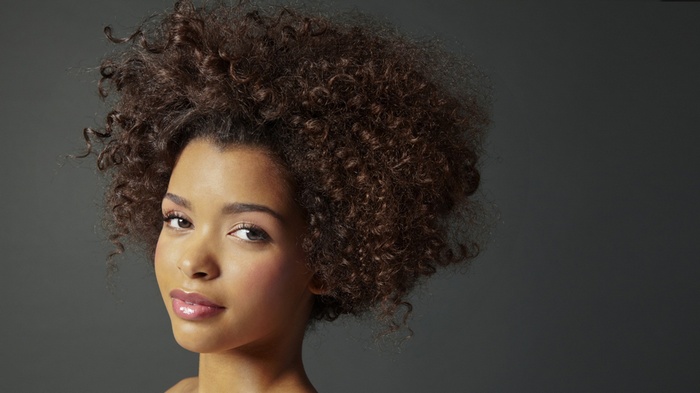 Woman with voluminous curly dark hair