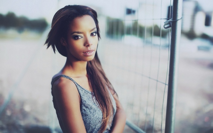 Woman with long brown hair and makeup