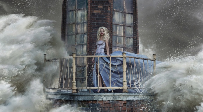 Woman in a dress on a balcony during a storm