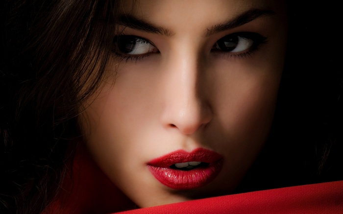 Woman with red lipstick and red scarf