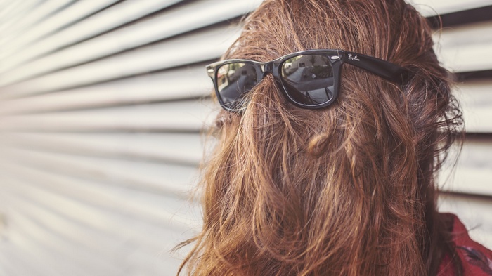 Woman with Ray-Ban sunglasses and brown hair