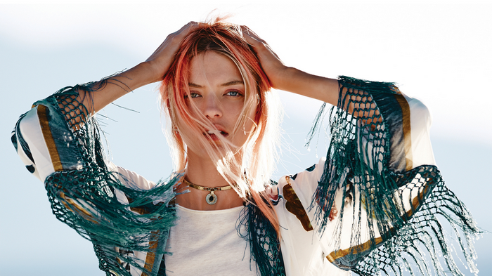 Martha Hunt with pink-streaked hair and fringe top