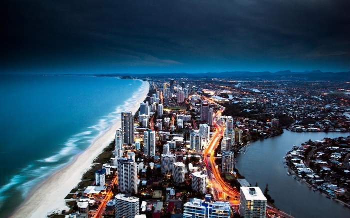 Gold Coast cityscape at dusk with ocean and river