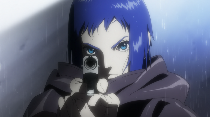 Motoko Kusanagi aims a gun in the rain