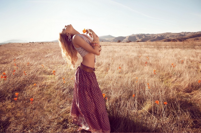 Lily Donaldson in a field of poppies