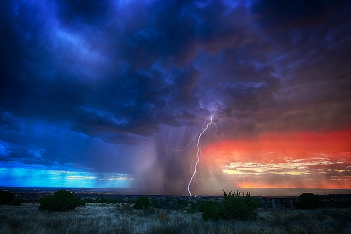 Lightning strikes during a storm over a landscape