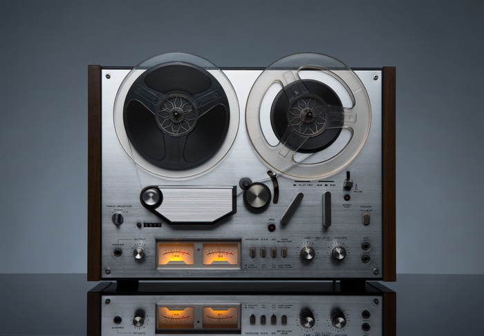 Vintage reel-to-reel tape recorder with VU meters