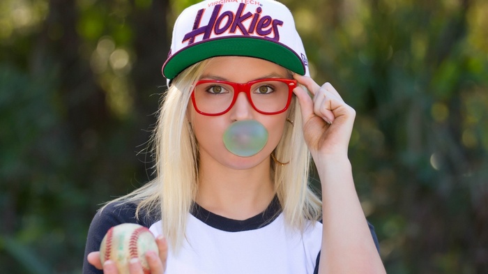 Woman with Hokies hat and bubble gum