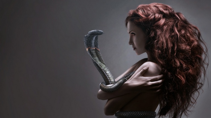 Redhead woman with a snake