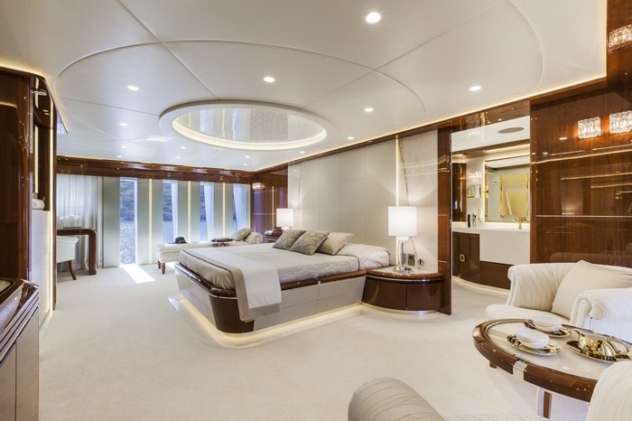 Luxury yacht bedroom with ensuite bathroom and seating area