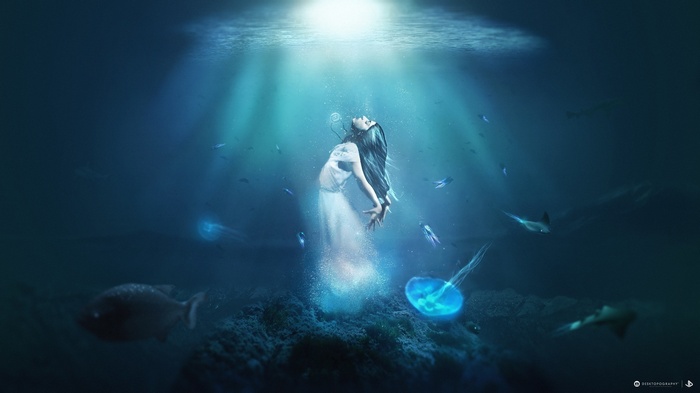 Fantasy art of a woman underwater with jellyfish