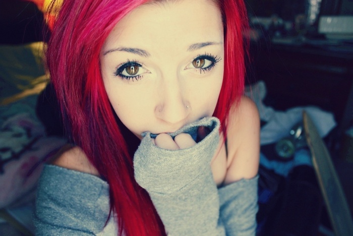 Young woman with bright red hair