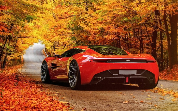 Red Aston Martin DBC on a road in autumn