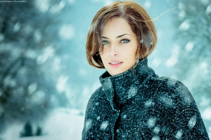 Sarah Allag in a black coat during snowfall