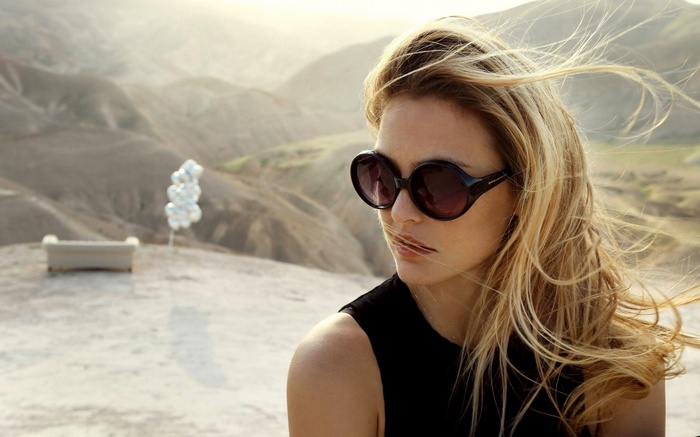 Bar Refaeli in sunglasses in a desert landscape