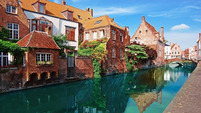 Bruges canal with historic brick buildings and a bridge